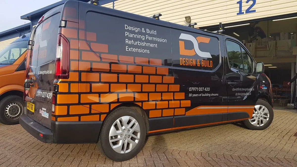 A van that is parked in front of a building.