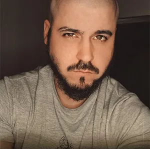 A man with a goatee and a beard.